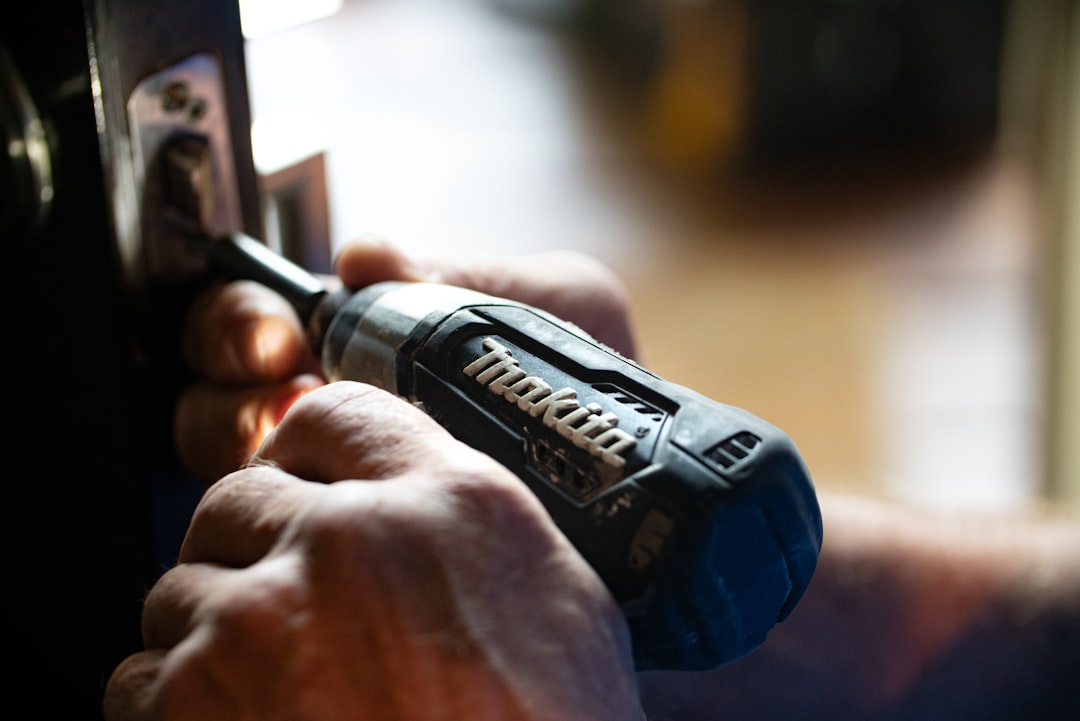 Technician diagnosing a kitchen appliance during an in-home repair call in Savannah, Georgia